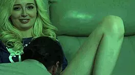 young petite babe cuddles old man on sofa during scary movie night