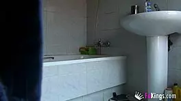 Sneaky shower peek at fingering dildo play