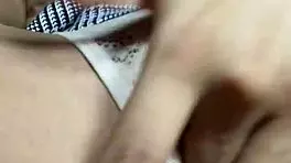 innocent petite babe lifts miniskirt to rub her sexy pussy