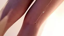 young asian beauty teases in sheer white pantyhose and stockings