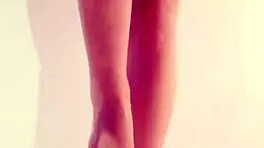 young asian beauty teases in sheer white pantyhose and stockings