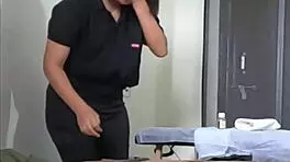 A young girl receives a relaxing handjob during massage session.