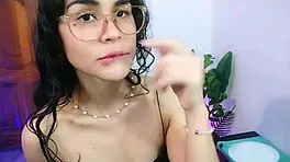 Beautiful brunette playfully explores with her wet fingers