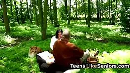 Old guy bends over brunette teen for outdoor doggystyle