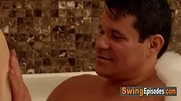 Hey this horny swinger couple gets steamy in hot tub sex