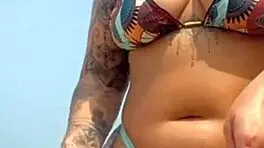 found this babe beach let him rub oil swollen pussy lips