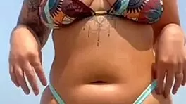 found this babe beach let him rub oil swollen pussy lips