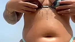 found this babe beach let him rub oil swollen pussy lips