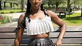 ebony beauty flashes big natural tits behind leather skirt outdoors