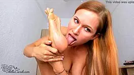 beautiful babe's tongue worships sexy feet in steamy close-up