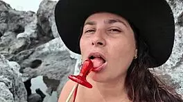 A curvy stepmom tests blowjob skills on beach candy to cock