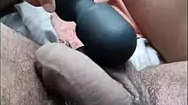 desi hottie strokes cock with feet while buzzing on bed