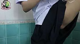Suggestive thai babe teases in school bathroom solo