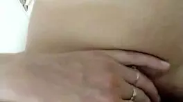 Teen brunette teases wet pussy close-up in steamy shower solo play