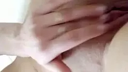 Teen brunette teases wet pussy close-up in steamy shower solo play