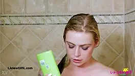 Radiant Blonde Enjoys Refreshing Shower Moment