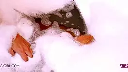 Sexy brunette teen bathes slowly revealing her perfect body curves