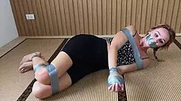 look at this redhead's sexy feet while she's ducttaped bound