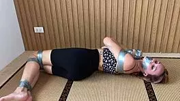 look at this redhead's sexy feet while she's ducttaped bound