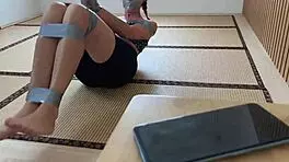 look at this redhead's sexy feet while she's ducttaped bound