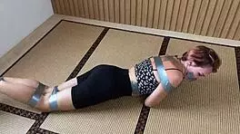 look at this redhead's sexy feet while she's ducttaped bound