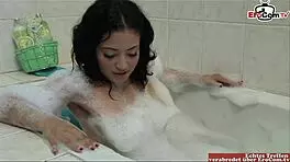 Wow, check out this hairy babe's natural tits bouncing as she masturbates furiously in the bathtub!
