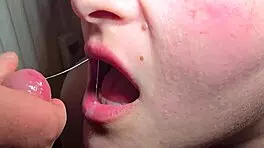 Close-up tongue catches every drop in explosive milf blowjob cumshot