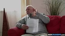 Young woman hesitates yet yields to older man's firm advance