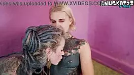 Inked alt girls tease each other with intense strap-on play