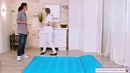 Busty redhead masseuse oils friend's body for nuru massage titty fuck handjob