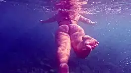 Pawg slips into thong bikini for underwater swim bath in crystal waters