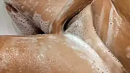 Tanned Big Tits Beauty Teases Pussy in Bathroom