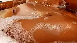 Tanned Big Tits Beauty Teases Pussy in Bathroom