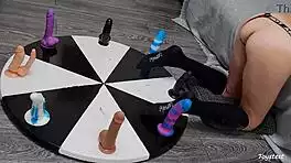 Wheel of dildos spins for her wild anal orgasm win