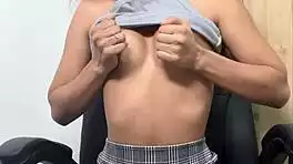 Sweet young beauty secretly pleasures herself in cozy chair alone