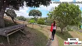 cute petite thai teen sucks massive white cock outdoors