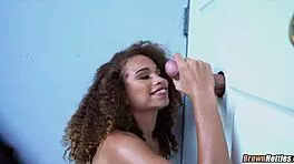 black hottie sucks massive cock through halloween gloryhole