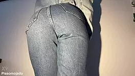 desperate girl soaks jeans in urgent pee stream