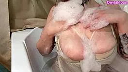 Washing my huge natural tits with thick rubber dick toy