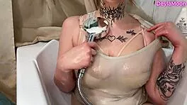 Washing my huge natural tits with thick rubber dick toy