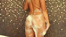 wow, tanned coed anjelica foams up sexy wet body!