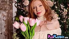 Redhead babe rips lingerie flashing shaved tits in garage striptease!