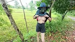 Thai babe hikes skirt flashing shaved pussy outdoors in garden