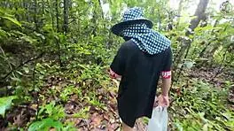 Thai babe hikes skirt flashing shaved pussy outdoors in garden