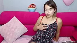 little cute brunette poses seductively on webcam solo