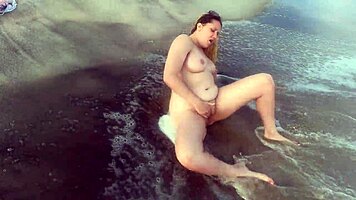 sexy blonde teen 18+ strips nude on public beach. she masturbates openly outdoors.