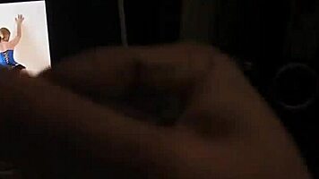 Man jerks off cock and watches porn and cums - slow motion