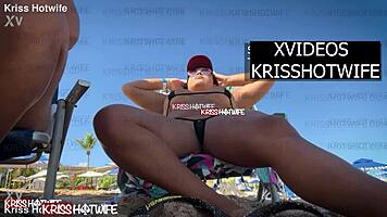 Kriss hotwife rocks micro bikini at beach showing off her big pussy.