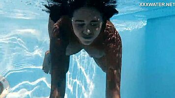 With her clothes set aside, Yorgelis seduces the producer by the pool underwater.