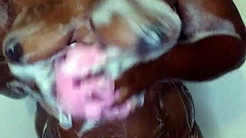 Young ebony babe enjoys a relaxing bath time massage with sensual touches.
